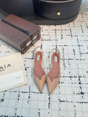 ALAIA FLAT SLINGBACK IN BEIGE BISQUE PATENT CALFSKIN AND FILM