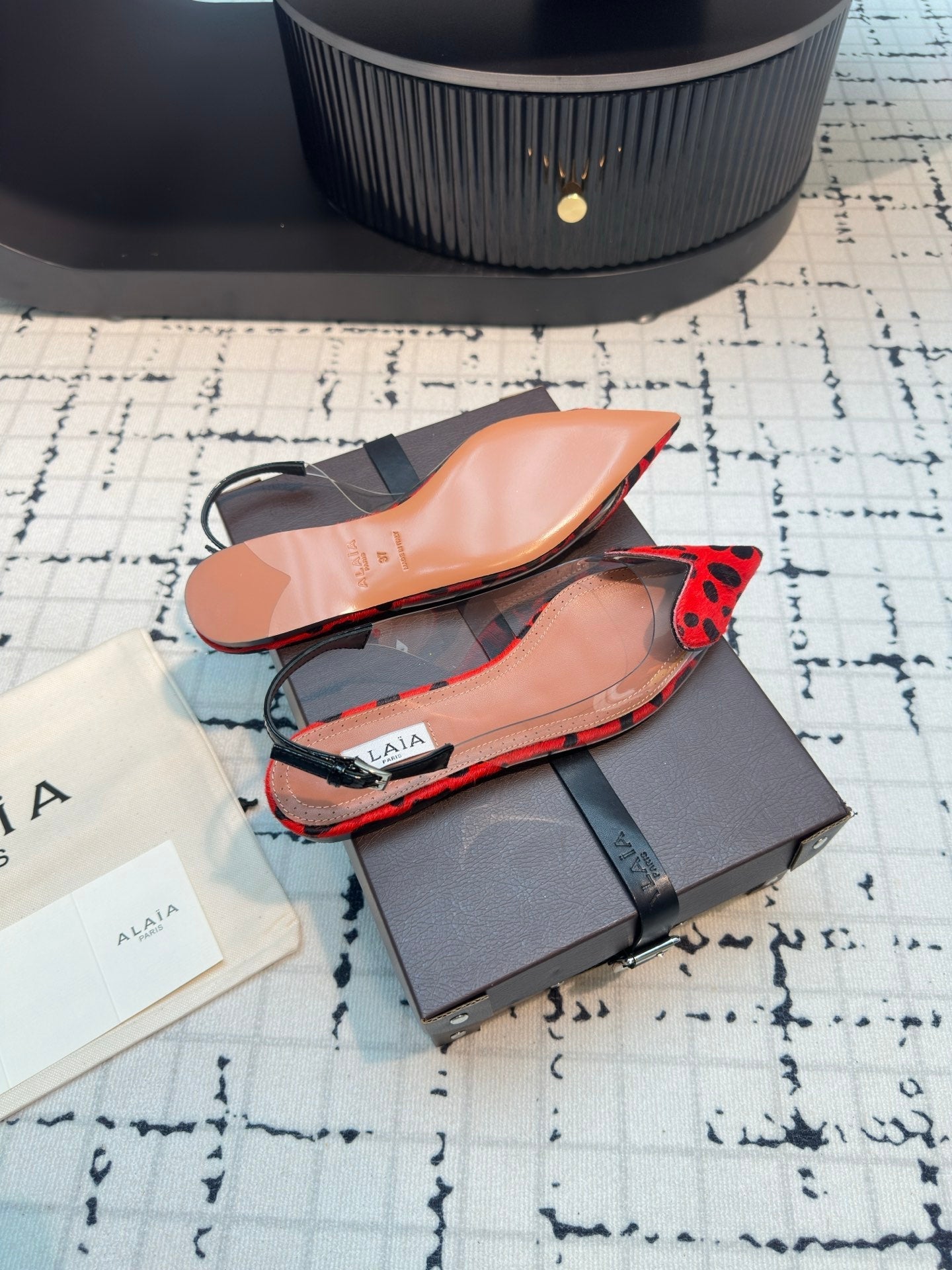 ALAIA FLAT SLINGBACK IN CHERRY RED PATENT CALFSKIN AND FILM