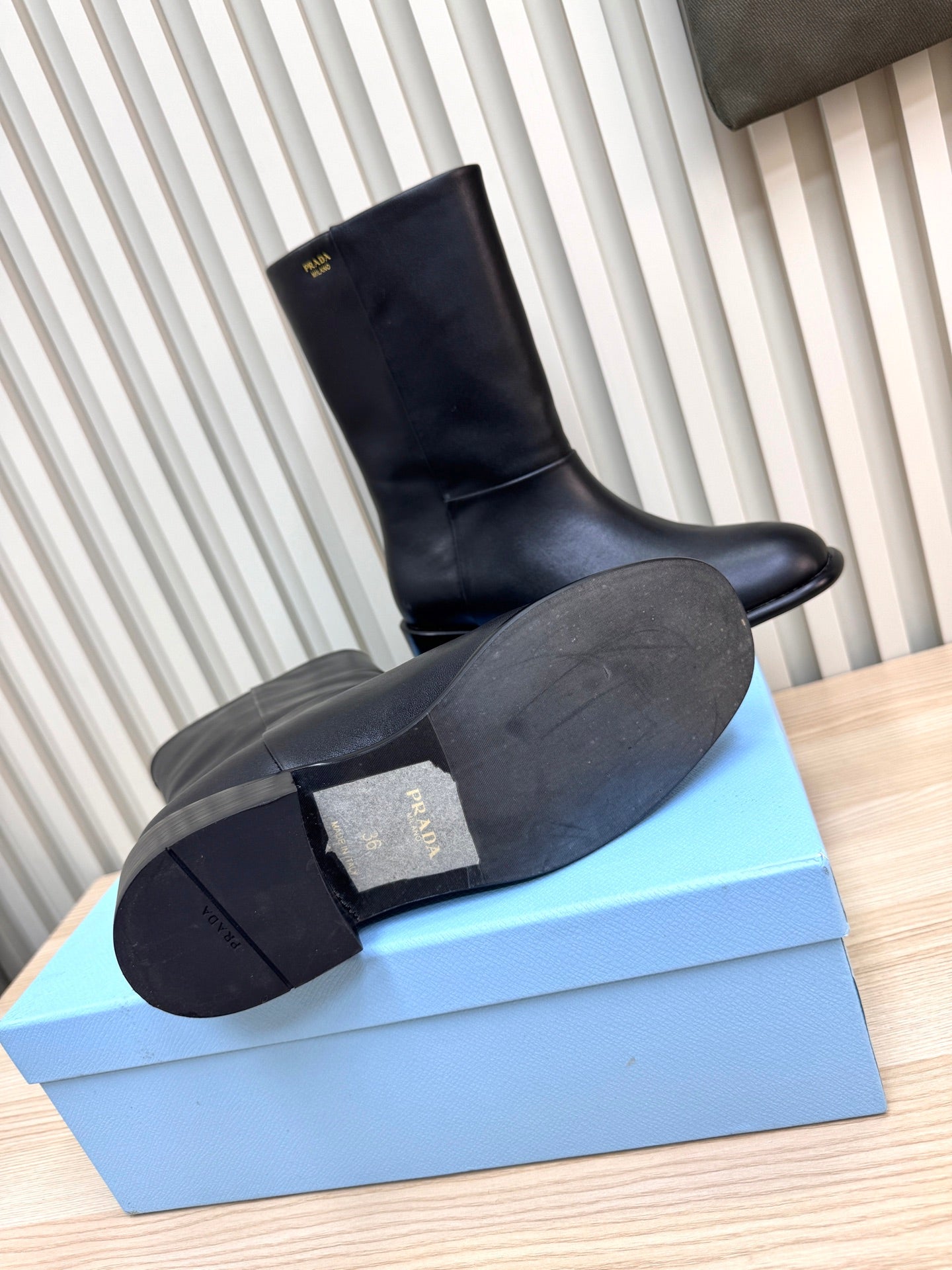 PRADA 25S LOW-CUT BOOTS IN BLACK LAMBSKIN