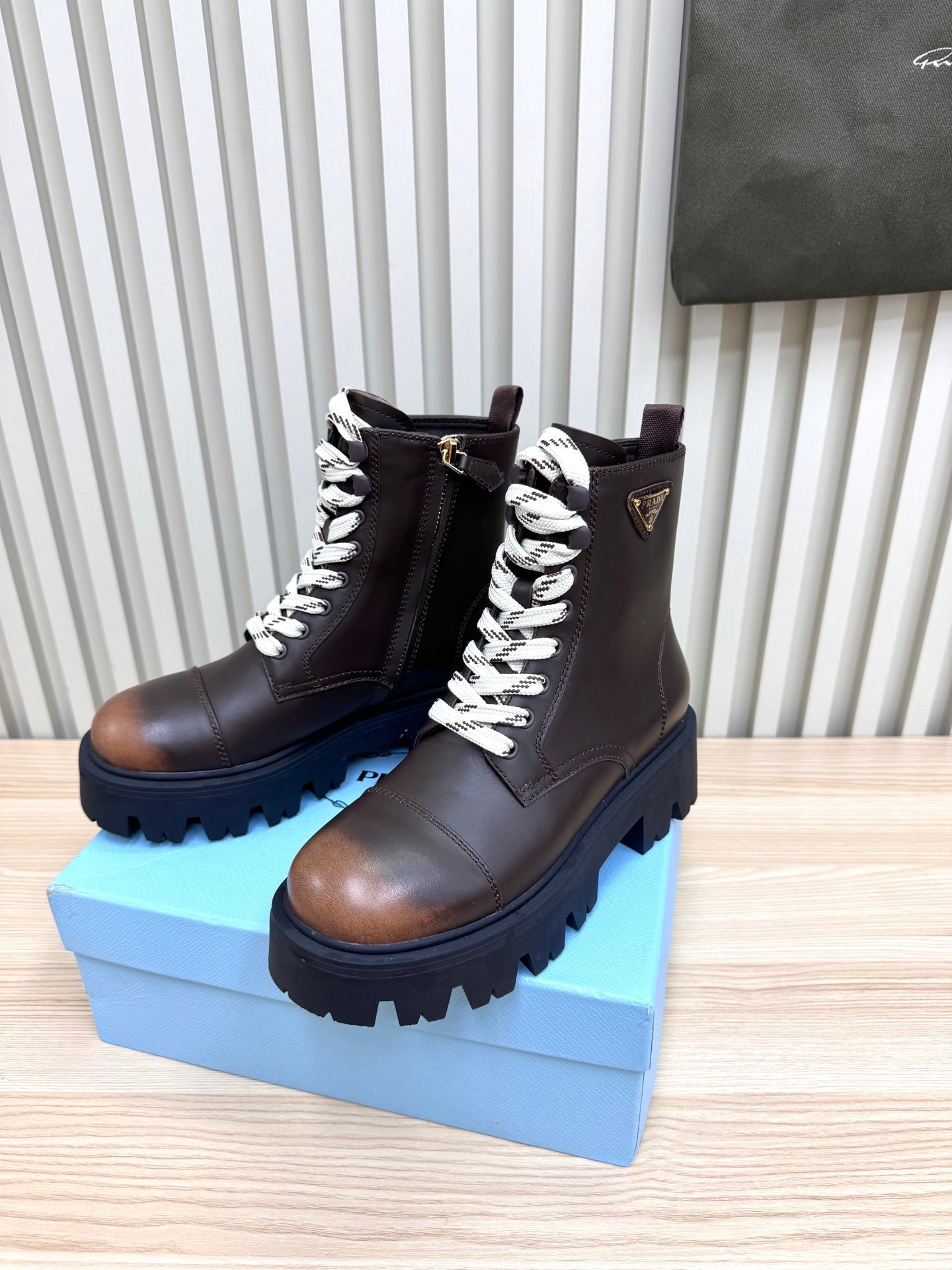 PRADA 25S MONOLITH BOOTS IN DARK BROWN CALFSKIN