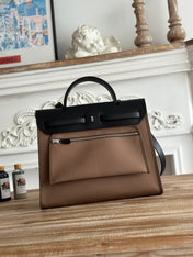 ZIP CABINE 31 BAG IN CHOCOLATE BROWN CANVAS AND BLACK CALFSKIN
