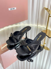 MIUMIU 26S MULE SANDALS 55MM IN BLACK CALFSKIN WITH BOW