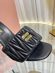 MIUMIU 26S HIGH-HEEL MULE SANDALS 85MM IN BLACK CALFSKIN GOLD HARDWARE
