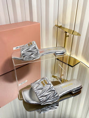 MIUMIU 26S MATELASSE SLIDES IN SILVER CALFSKIN GOLD HARDWARE