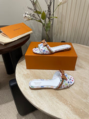 FLAT MULES IN WHITE MONOGRAM LAMBSKIN