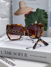 TRIOMPHE SUNGLASS 497830 IN HAVANA ACETATE EMBOSSED LOGO