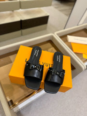 LV X TM 6AM FLAT MULE IN BLACK CALFSKIN