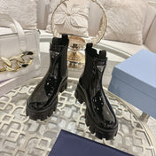 PRADA 26S MONOLITH CHELSEA BOOTS IN BLACK PATENT CALFSKIN AND FABRIC