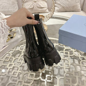 PRADA 26S MONOLITH CHELSEA BOOTS IN BLACK PATENT CALFSKIN AND FABRIC