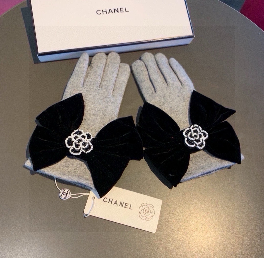 GLOVES IN DOVE GRAY WOOL WITH LARGE BLACK BOW 464994