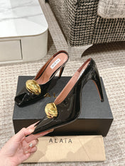 ALAIA SPIKE JEWEL MULES IN BLACK GLOSSY CALFSKIN WITH GOLD HARDWARE