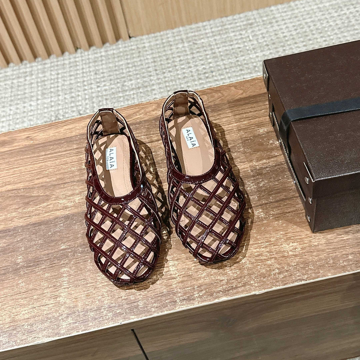 ALAIA MESH BALLET FLATS 25S IN DARK RED LAMBSKIN
