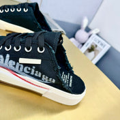 SNEAKER MULES IN BLACK CANVAS GRAFFITI LOGO