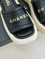 PLATFORM SLIPPERS IN BLACK LAMBSKIN