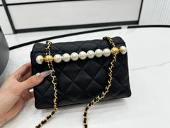 CHANEL 25S FLAP BAG 19 CM IN BLACK LAMBSKIN WITH PEARL TOP HANDLE