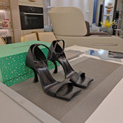 OPEN-TOE CURVED HIGH HEEL SANDALS IN BLACK SMOOTH CALFSKIN
