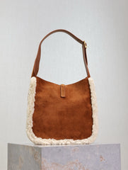 LE 5 À 7 SMALL SUPPLE 23 IN AMBER ORANGE SUEDE AND WHITE LAMB FUR TRIM