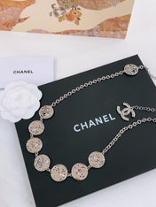 TWISTED CHAIN BELT WITH RHINESTONES AND LOGO PLATE IN SILVER TONE