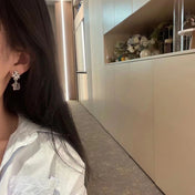 19 DOUBLE C SNOW SILVER EARRINGS